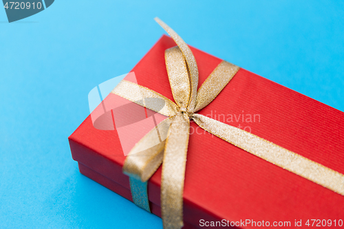 Image of christmas red gift box on blue background