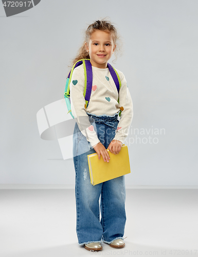 Image of happy little girl with school backpack