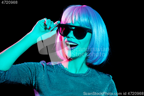 Image of happy woman in pink wig and black sunglasses