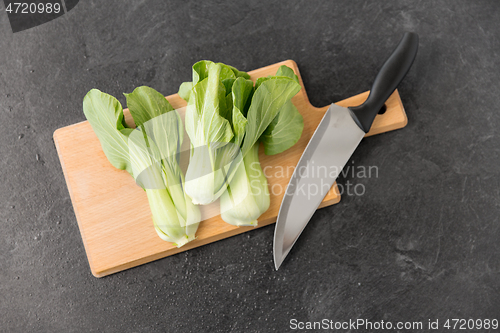 Image of bok choy cabbage and knife on cutting board