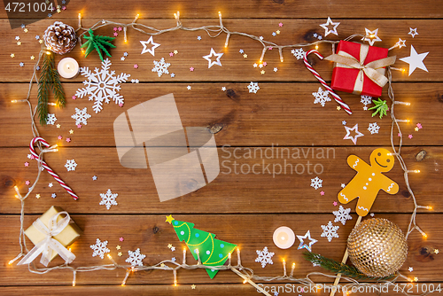 Image of christmas gifts and decorations on wooden boards