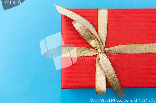 Image of christmas red gift box on blue background