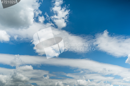 Image of Fluffy clouds in blue sky