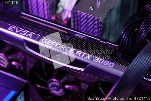 Image of Geforce RTX 3090 Nvidia GPU graphics card inside a gaming computer configuration