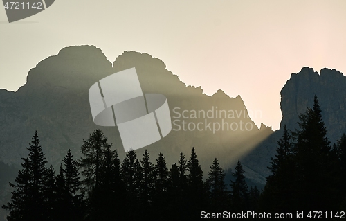 Image of Sunrise between mountain cliffs