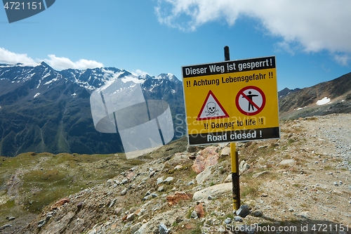 Image of Path in the mountainsed closed with warning sign