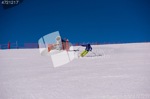 Image of Skier having fun while running downhill