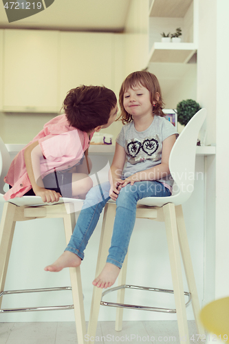 Image of cute little brother and sister at home