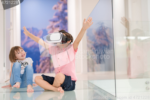 Image of kids using virtual reality headsets at home