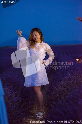 Image of portrait of and asian woman in lavender flower field