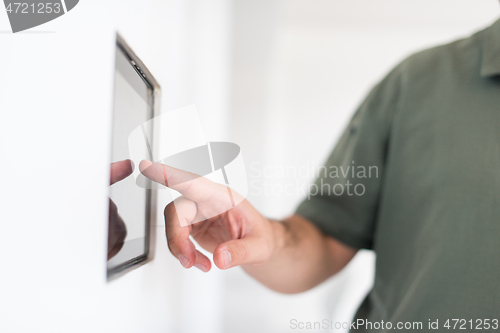 Image of smart home and technology concept close up of male hands