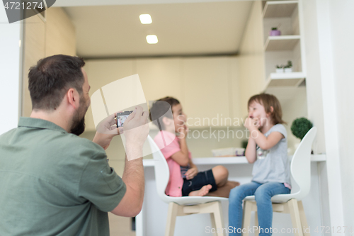 Image of cute little brother and sister at home