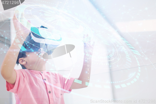 Image of kid at home playing games on  vr glasses