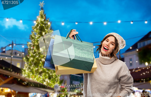 Image of woman with shopping bags at christmas market