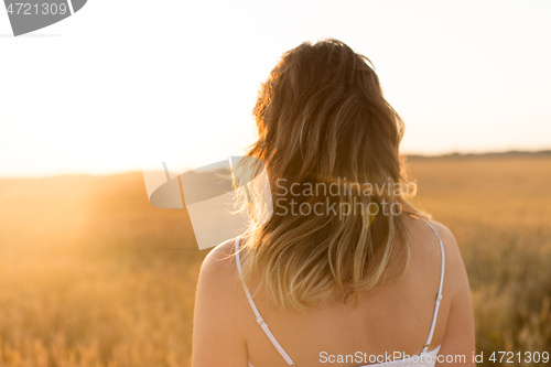 Image of woman on cereal field in summer