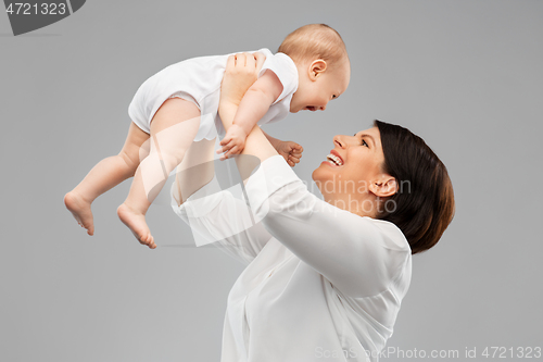 Image of happy middle-aged mother with little baby daughter