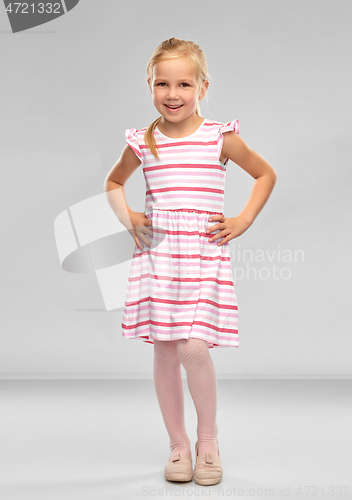 Image of smiling little girl in striped dress