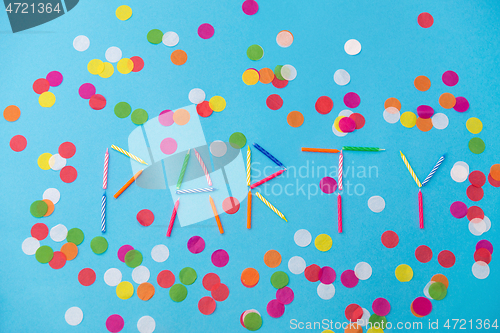 Image of word party made of birthday candles on blue