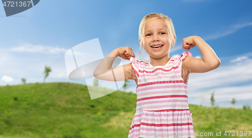 Image of smiling little girl showing her power in summer