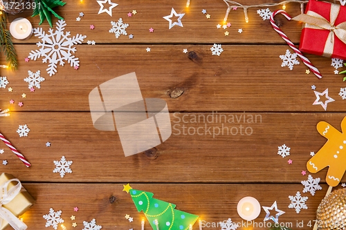 Image of christmas gifts and decorations on wooden boards