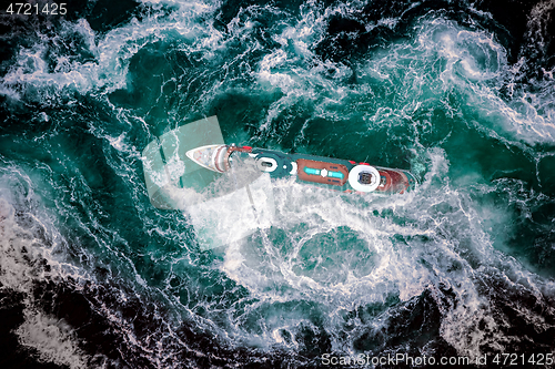 Image of Storm waves of the sea around the ship.