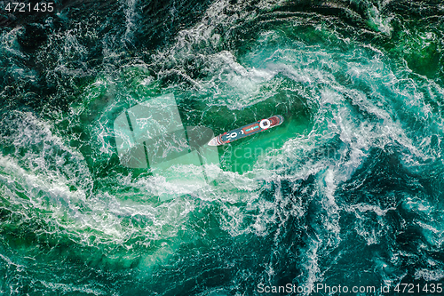 Image of Storm waves of the sea around the ship.