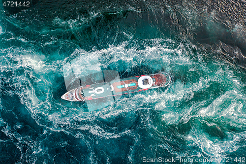 Image of Storm waves of the sea around the ship.