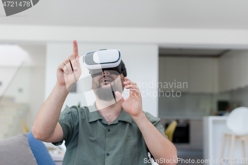 Image of man with beard trying vr glasses