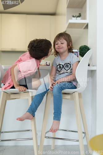 Image of cute little brother and sister at home