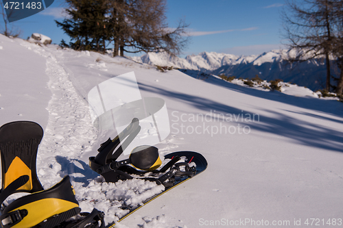 Image of snowboard in snow