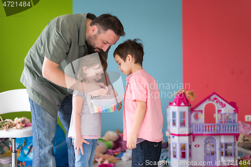 Image of sister and brother havin fun and play hairstylist game at home