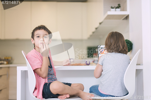 Image of cute little brother and sister at home