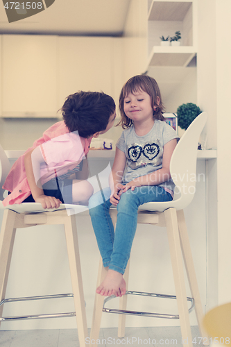 Image of cute little brother and sister at home