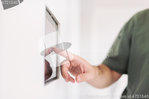 Image of smart home and technology concept close up of male hands