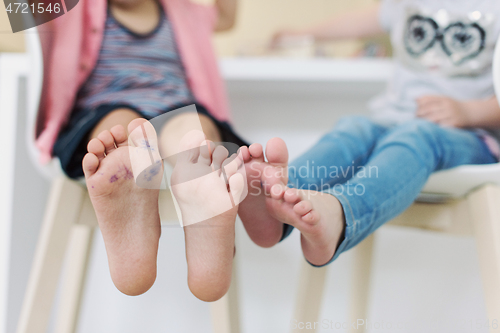 Image of cute little brother and sister at home