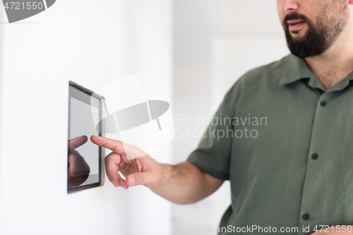 Image of smart home and technology concept close up of male hands