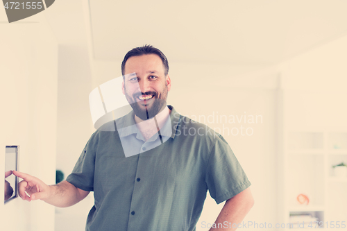 Image of smart home and technology concept close up of male hands