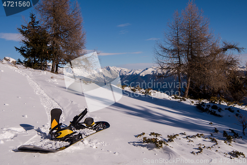 Image of snowboard in snow