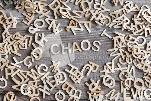 Image of some wooden letters and the word chaos