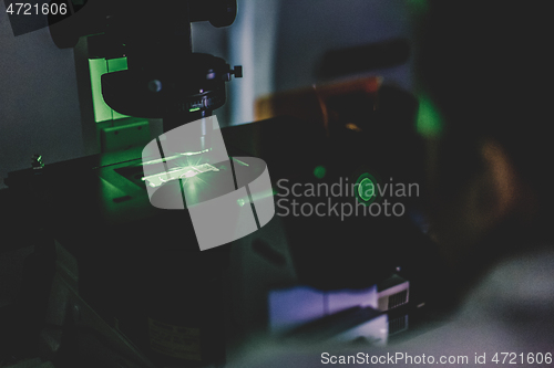 Image of Life science researcher microscoping in genetic scientific laboratory.