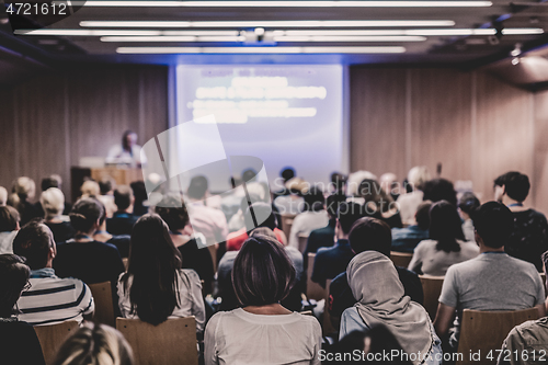 Image of Business speaker giving a talk at business conference event.