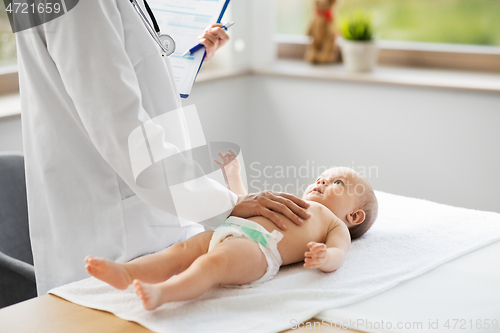 Image of female pediatrician doctor with baby at clinic