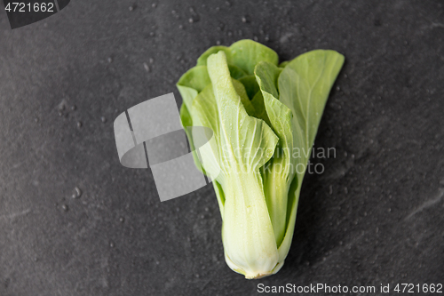 Image of close up of bok choy cabbage on slate background