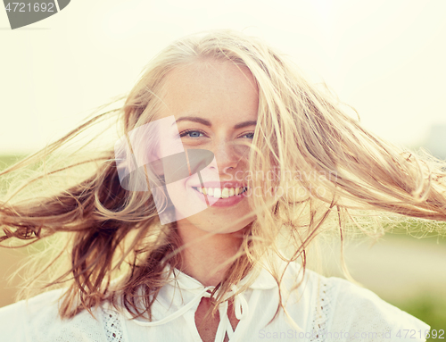 Image of close up of happy young woman in white outdoors