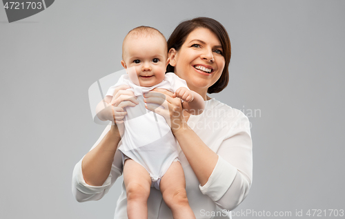 Image of happy middle-aged mother with little baby daughter