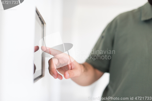 Image of smart home and technology concept close up of male hands