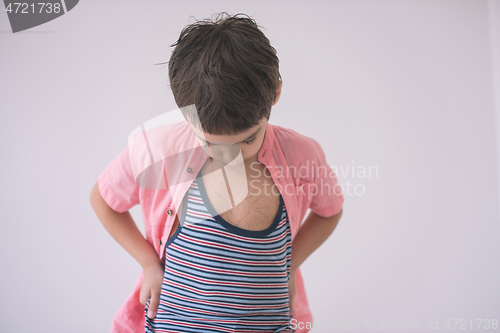 Image of lilittle boy looking at heart love symbol sketched on his chest