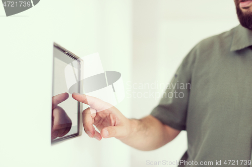 Image of smart home and technology concept close up of male hands