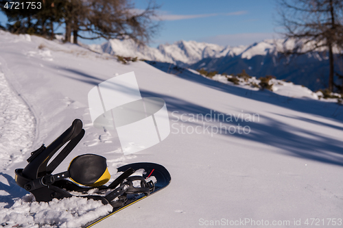 Image of snowboard in snow