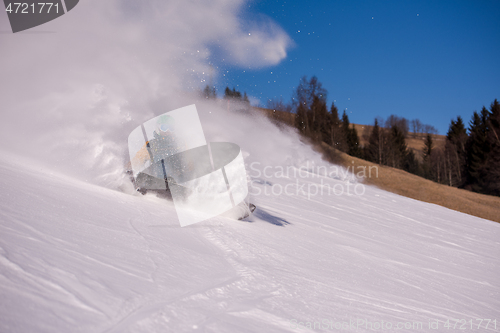 Image of snowboarder crashes while carving down